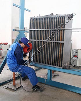 Rotating rack for radiator welding